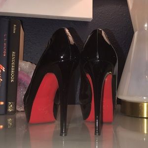 Christian Louboutin black patent pumps